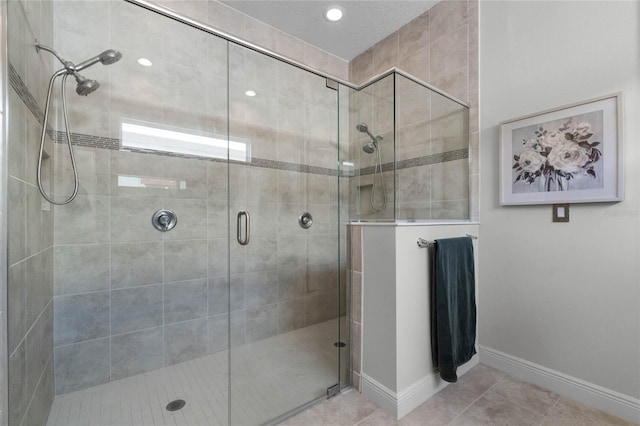 bathroom featuring tile patterned flooring and walk in shower