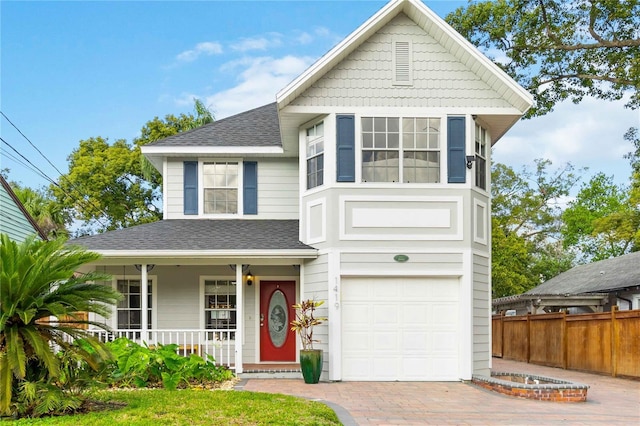 view of front of home with a porch and a garage