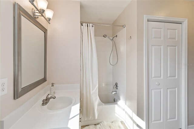 bathroom with vanity and shower / bathtub combination with curtain