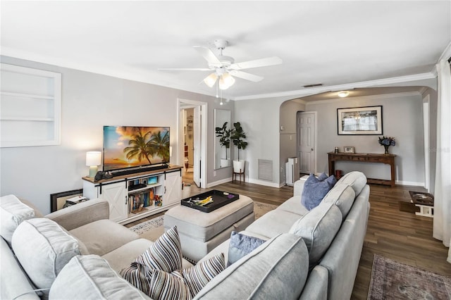 living room featuring ornamental molding, dark hardwood / wood-style floors, and ceiling fan