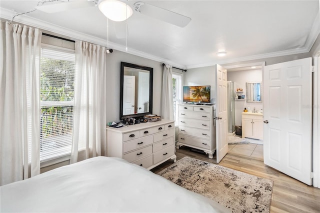 bedroom with sink, crown molding, ensuite bath, light hardwood / wood-style flooring, and ceiling fan