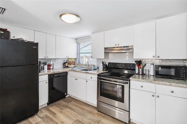 kitchen featuring sink, black appliances, and white cabinets