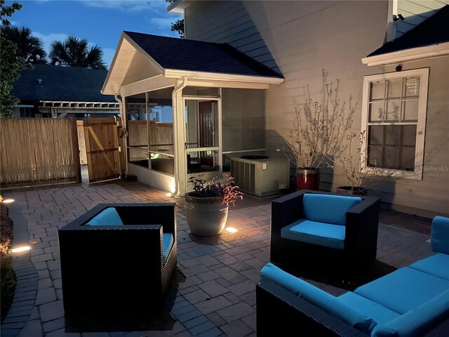 patio terrace at dusk featuring an outdoor hangout area