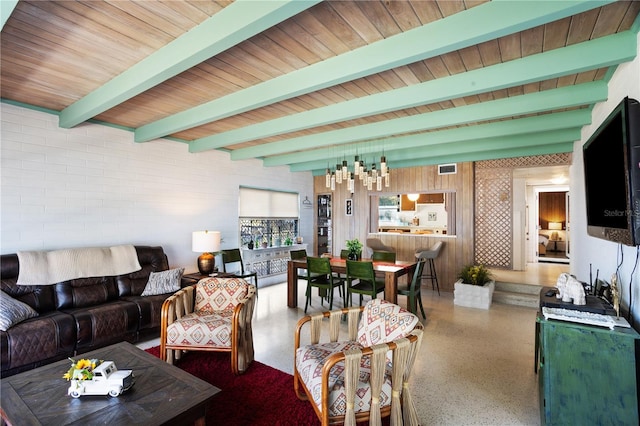 814 S Lakeshore Blvd, Lake Wales, FL 33853 - living room featuring beamed ceiling and an inviting chandelier