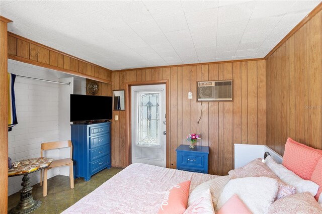 814 S Lakeshore Blvd, Lake Wales, FL 33853 - bedroom featuring an AC wall unit and wood walls