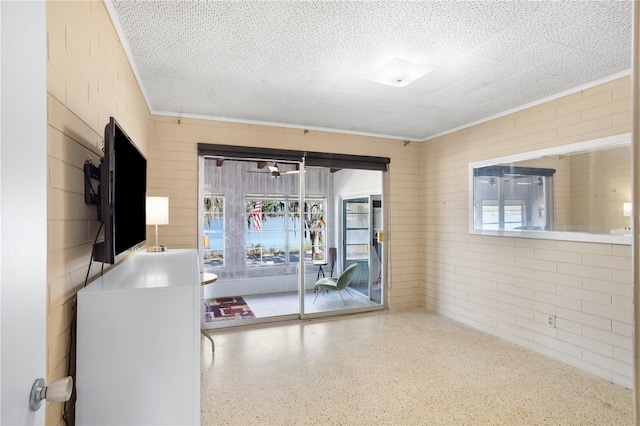 814 S Lakeshore Blvd, Lake Wales, FL 33853 - unfurnished room with crown molding, plenty of natural light, and a textured ceiling