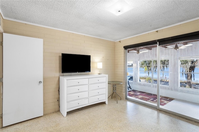 814 S Lakeshore Blvd, Lake Wales, FL 33853 - bedroom with crown molding, access to outside, and a textured ceiling