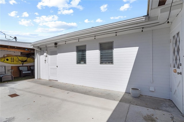 814 S Lakeshore Blvd, Lake Wales, FL 33853 - view of side of home with a patio area