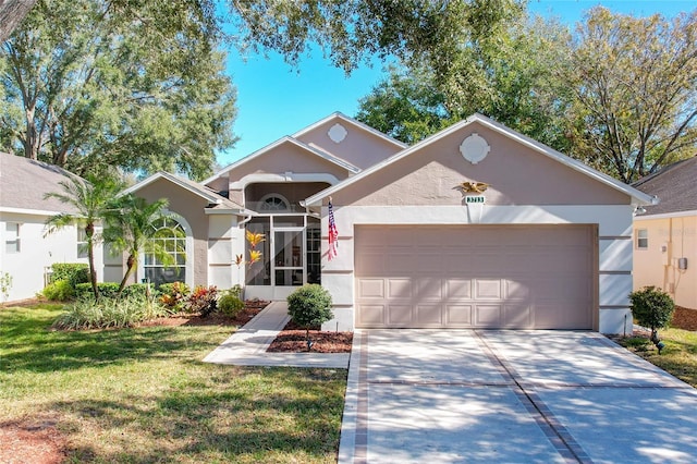 view of front of property featuring a garage and a front lawn