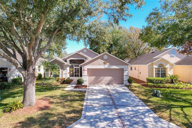 view of front of property featuring a garage and a front lawn