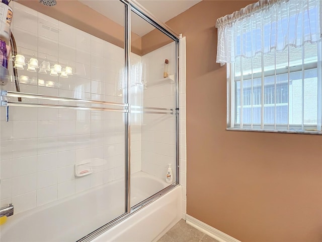 bathroom with tile patterned flooring and enclosed tub / shower combo