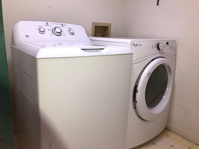 laundry area with independent washer and dryer