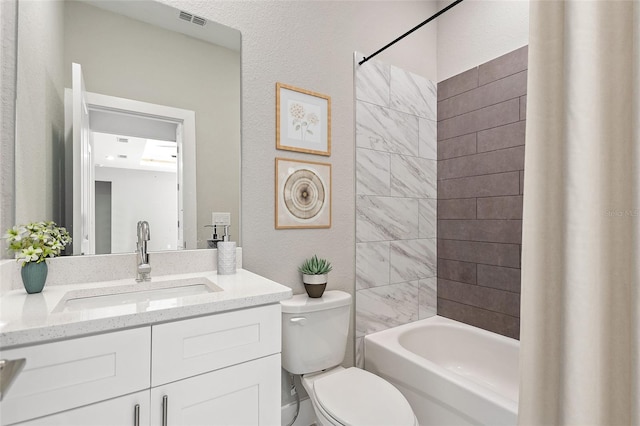 full bathroom featuring shower / tub combo with curtain, vanity, and toilet