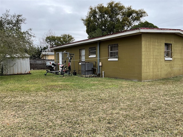 rear view of house with a lawn