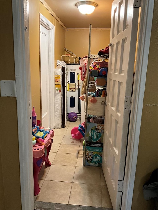 interior space with gas water heater and electric water heater