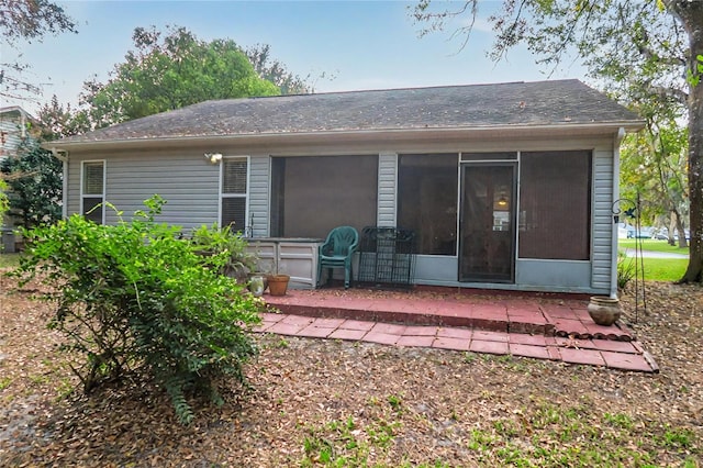 back of house with a patio area