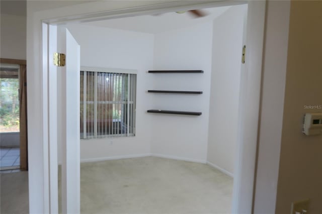 unfurnished room featuring light colored carpet