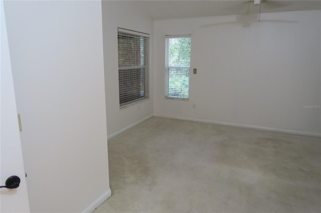 empty room with light colored carpet