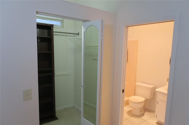 bathroom with vanity, tile patterned floors, and toilet