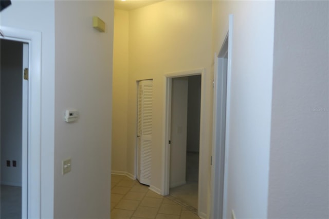 corridor featuring light tile patterned floors