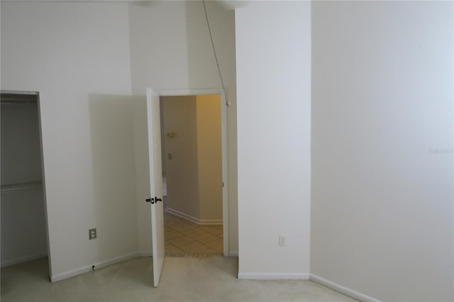 unfurnished bedroom featuring light colored carpet