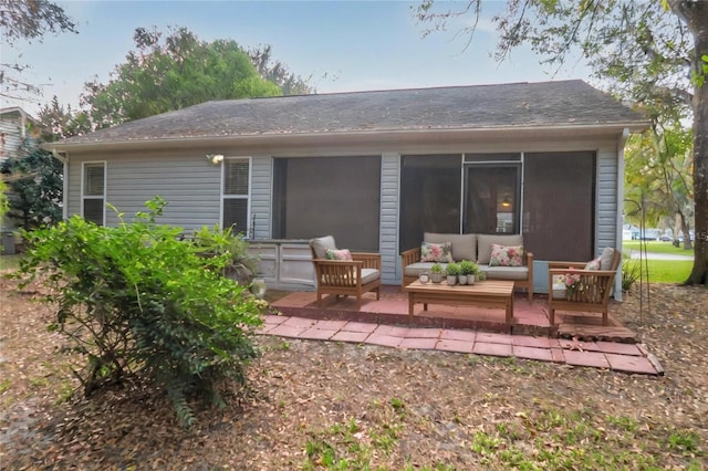 rear view of house with an outdoor hangout area and a patio area