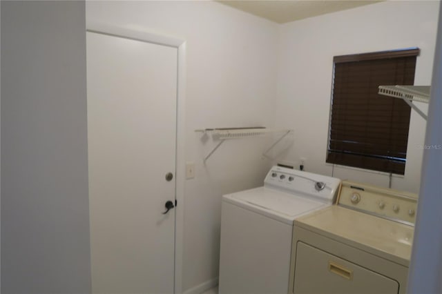 laundry room with independent washer and dryer