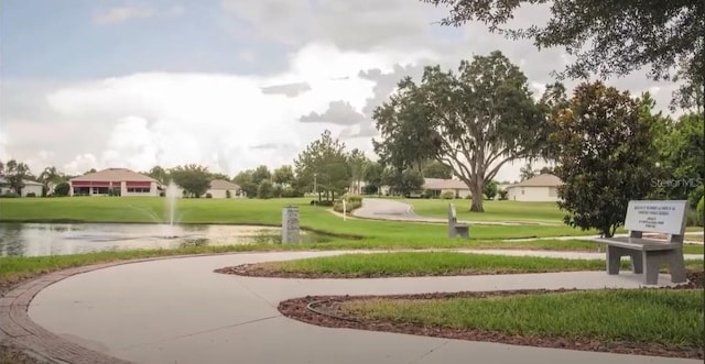 view of property's community featuring a yard