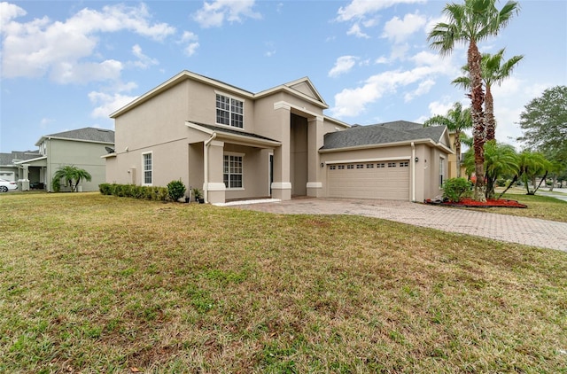 view of front of house featuring a garage and a front lawn