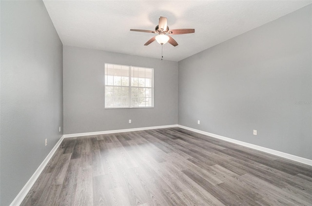 spare room featuring ceiling fan and wood-type flooring