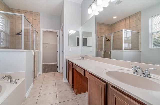 bathroom featuring vanity, independent shower and bath, and tile patterned flooring