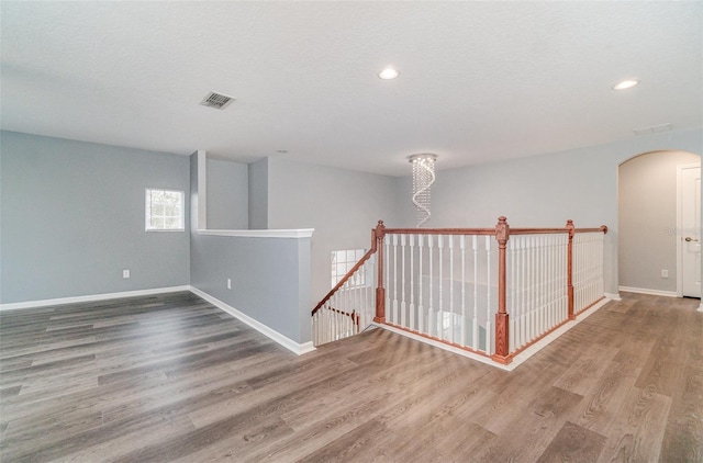 interior space featuring hardwood / wood-style floors and a textured ceiling