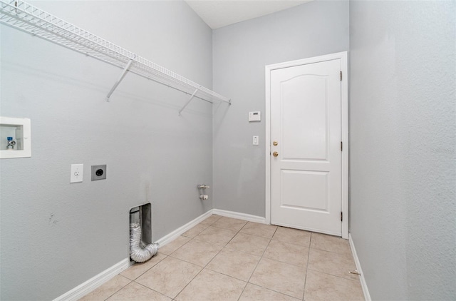 laundry room featuring hookup for a gas dryer, hookup for a washing machine, hookup for an electric dryer, and light tile patterned flooring