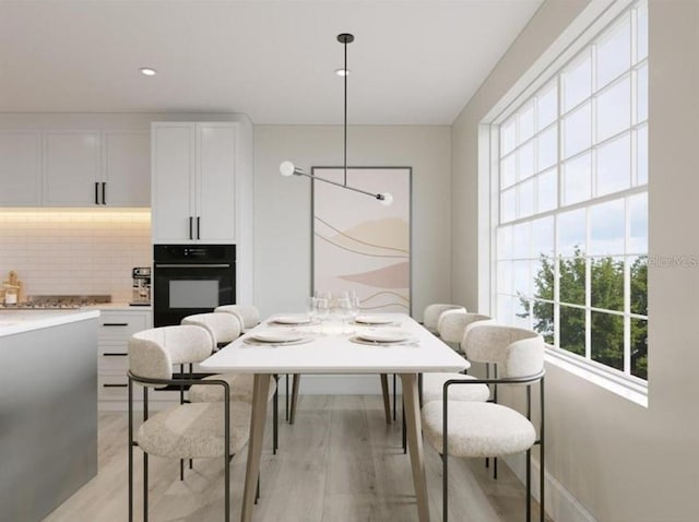 dining space featuring light hardwood / wood-style floors