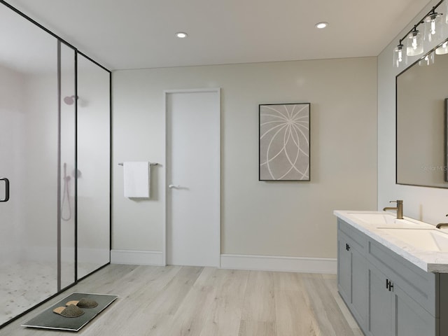 bathroom featuring a shower with door, vanity, and hardwood / wood-style floors