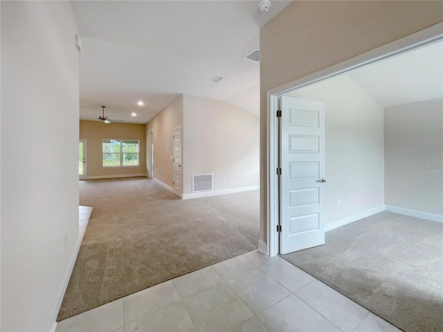 unfurnished room featuring light carpet and ceiling fan