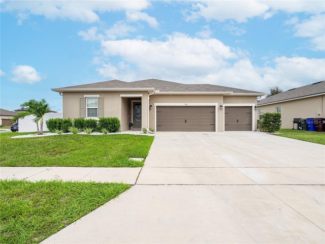 view of front of property with a garage and a front yard