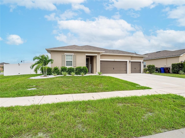 view of front of home with a garage and a front yard