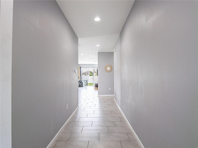 hallway featuring light tile patterned flooring