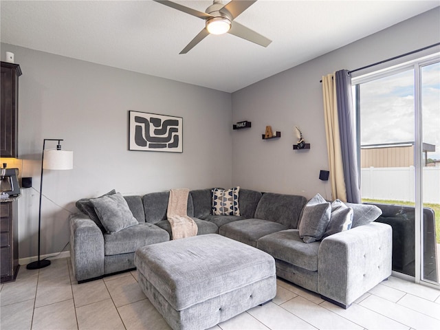 tiled living room featuring ceiling fan