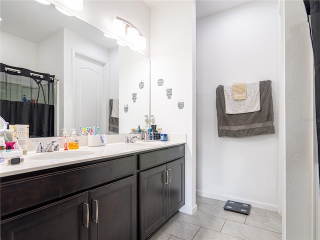 bathroom featuring tile patterned flooring and vanity