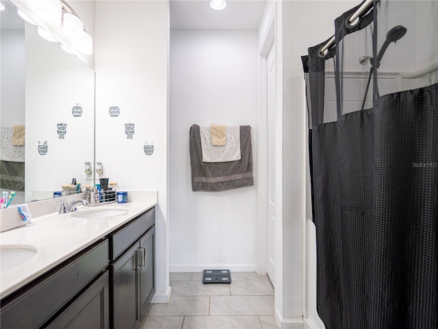 bathroom with tile patterned flooring, vanity, and a shower with curtain