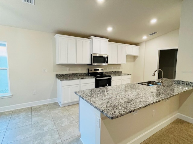 kitchen with white cabinetry, sink, kitchen peninsula, light stone countertops, and electric stove