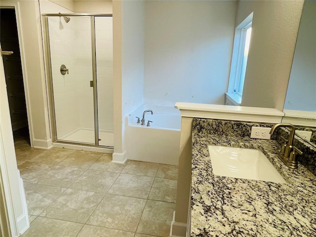 bathroom with tile patterned floors, separate shower and tub, and vanity