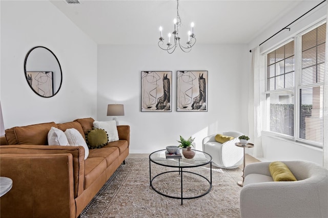 living room featuring a notable chandelier