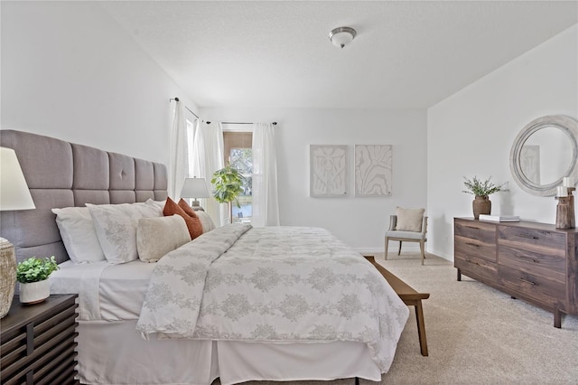 carpeted bedroom with a textured ceiling