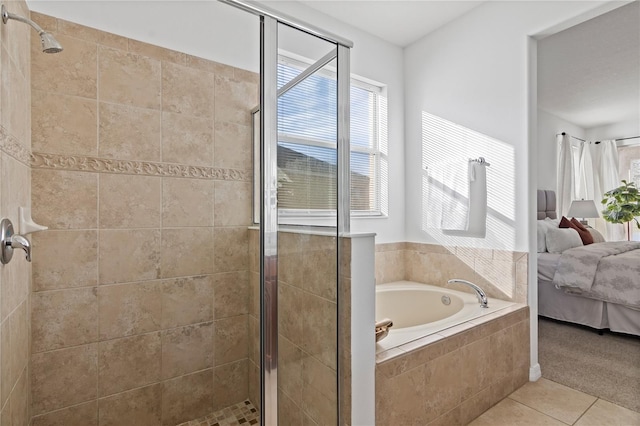 bathroom featuring tile patterned floors and shower with separate bathtub