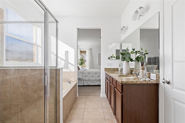 bathroom featuring tile patterned floors, plus walk in shower, and vanity