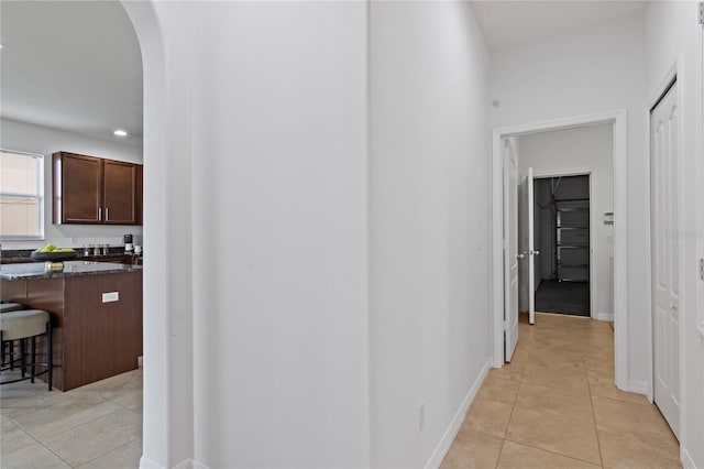 hallway with light tile patterned floors