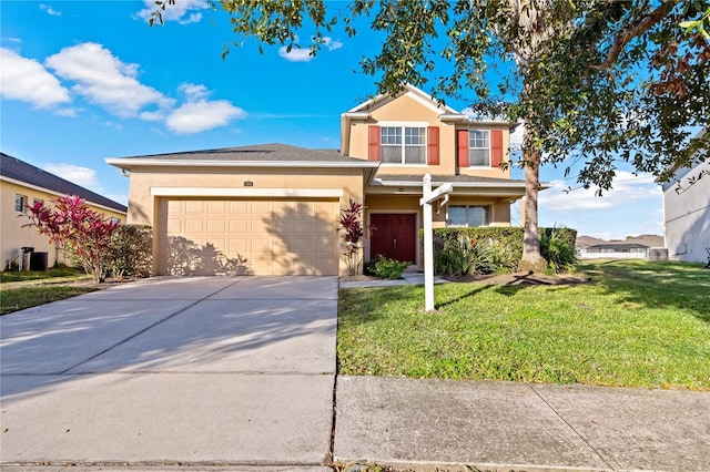 view of front of house featuring a garage and a front yard